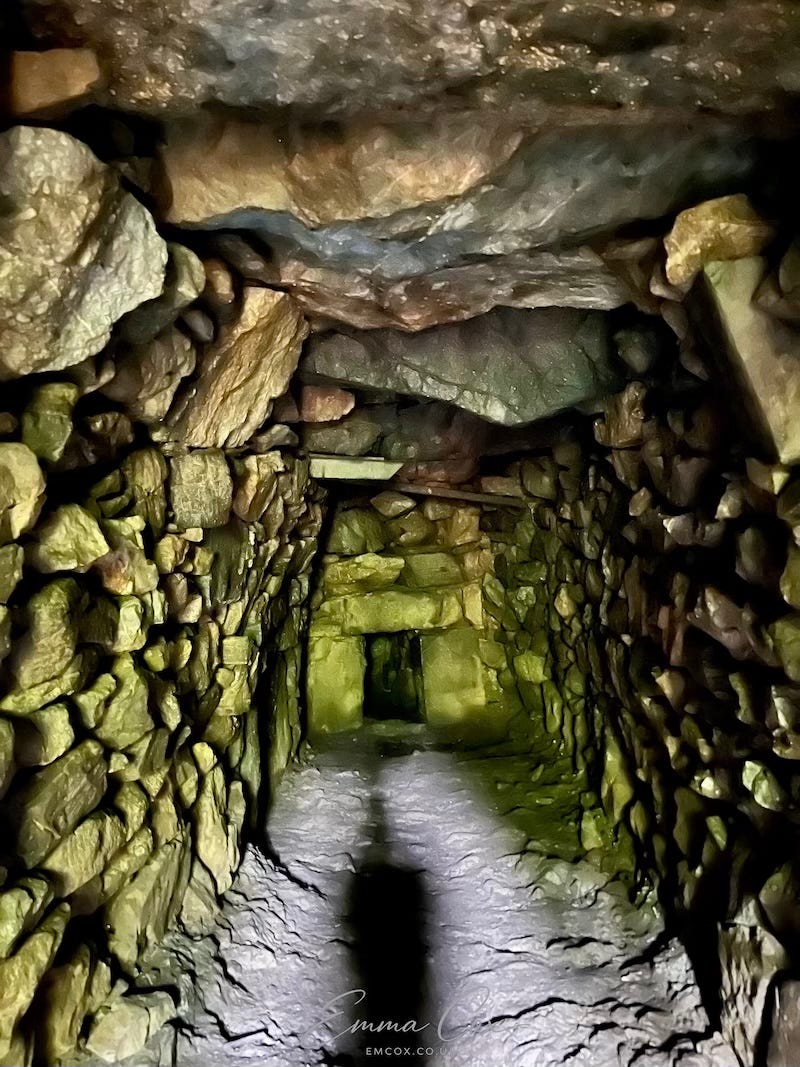 an underground passage with drystone walls and a lintel ceiling an underground passage with drystone walls and a lintel ceiling