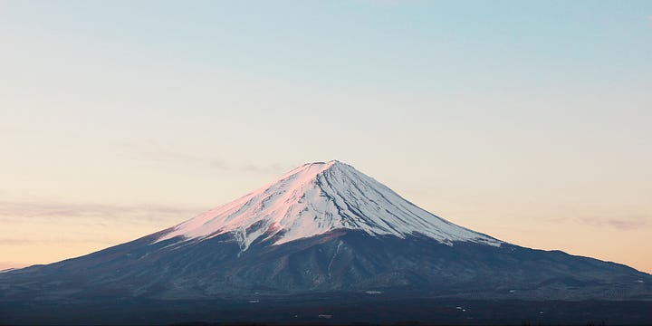 One image of Mt Fuji without any clouds, and another of an accessible van with a lift for wheelchair users. 