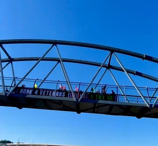 A bridge with a sign on it
AI-generated content may be incorrect. A bridge with a sign on it
AI-generated content may be incorrect.