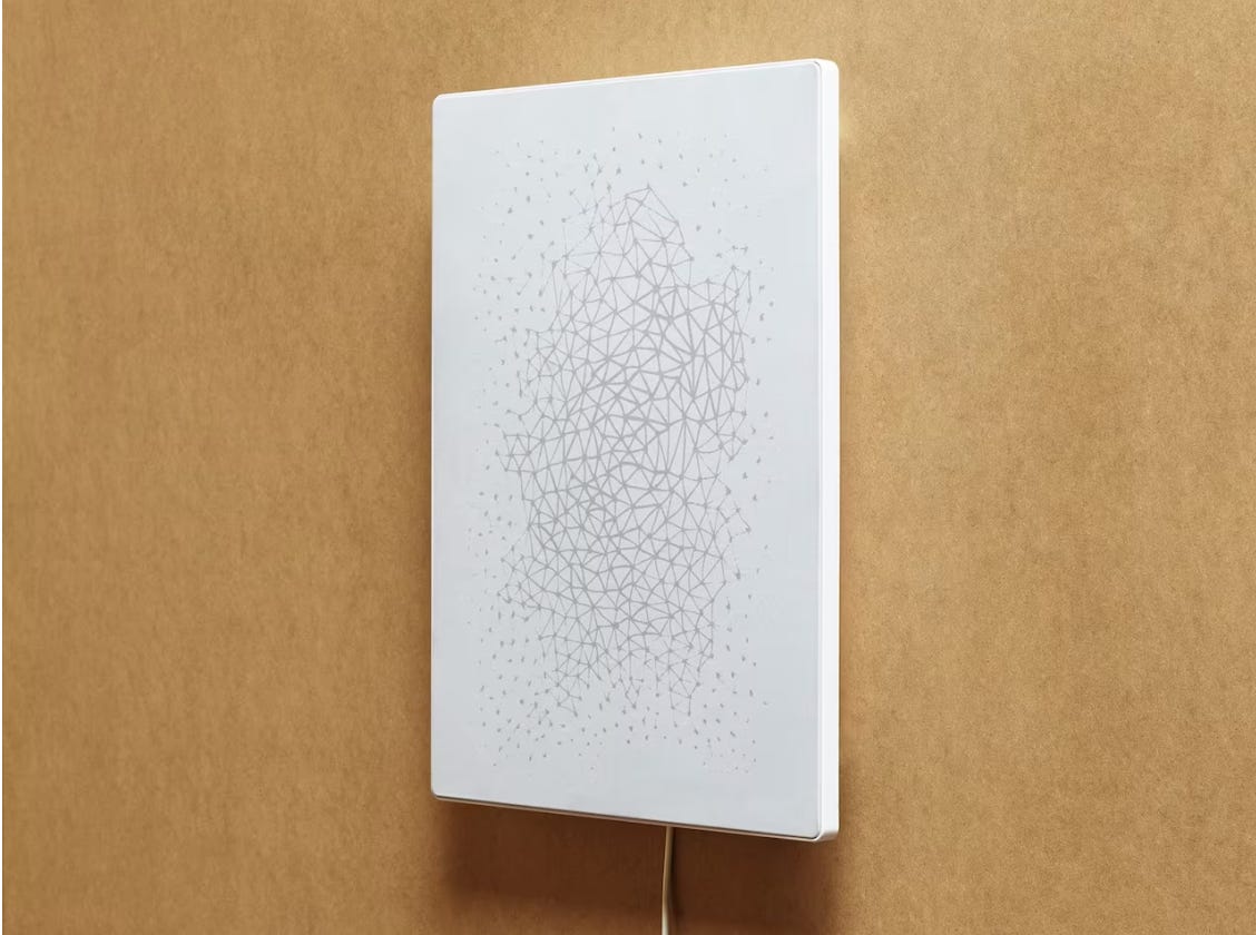 a hanging picture frame embedded with a speaker a hanging picture frame embedded with a speaker