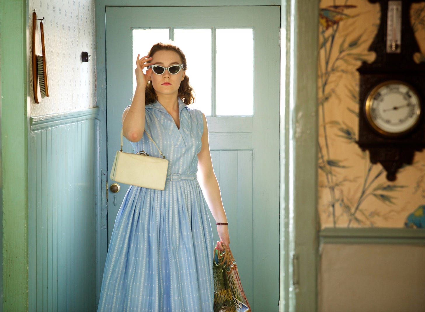 Eilis in a blue dress from the movie Brooklyn