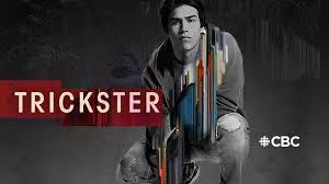 Show poster depicting a squatting young man with dark hair