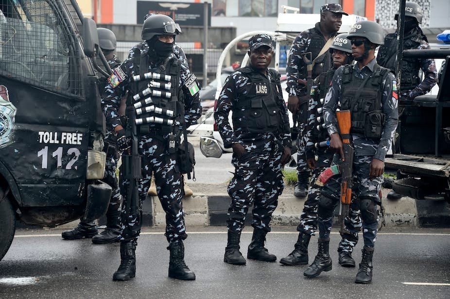 Police officers standing Police officers standing