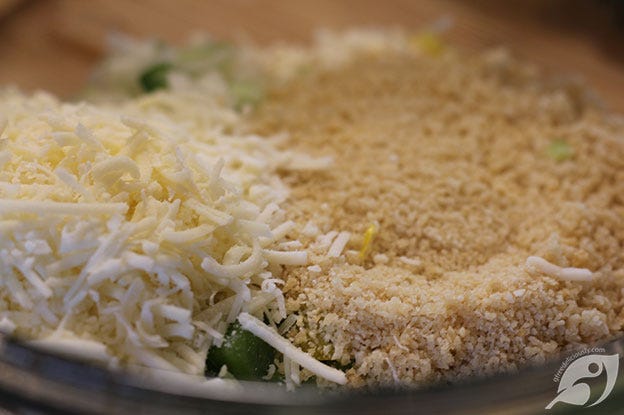 showing the breadcrumbs and Romano cheese added to the bowl. showing the breadcrumbs and Romano cheese added to the bowl.