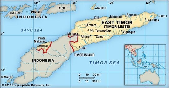 Map of East Timor (Timor-Leste) on Timor Island, showing its boundaries with Indonesia, major cities such as Dili, Baucau, and Suai, and the exclave of Ambeno. An inset locator map highlights East Timor's position in Southeast Asia.