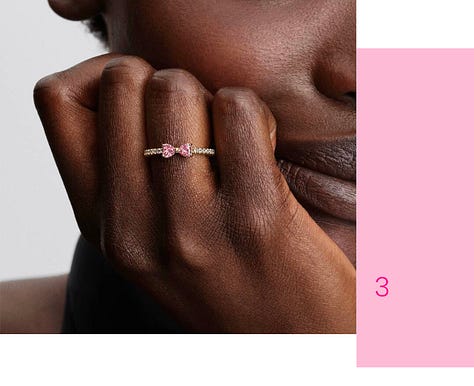 Women wearing crystal jewelry with pink accents. 