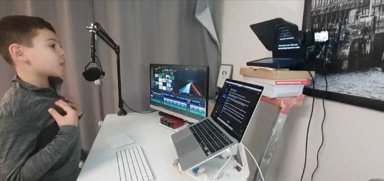 My son in front of the camera recording a YouTube video