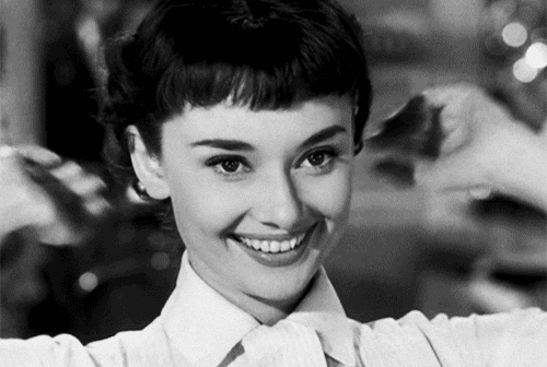 Audrey Hepburn looking delighted with a short hair cut and fringe in the film Roman Holiday Audrey Hepburn looking delighted with a short hair cut and fringe in the film Roman Holiday