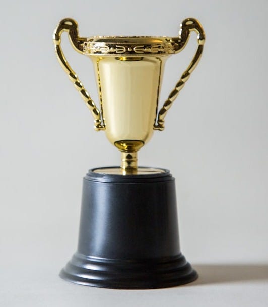 yellow and white trophy yellow and white trophy