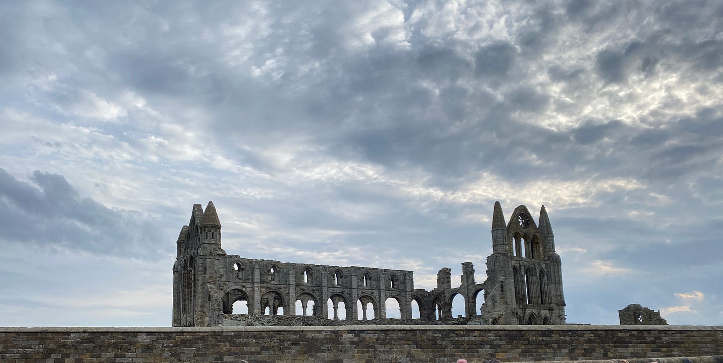 Whitby Abbey with dark grey sky.