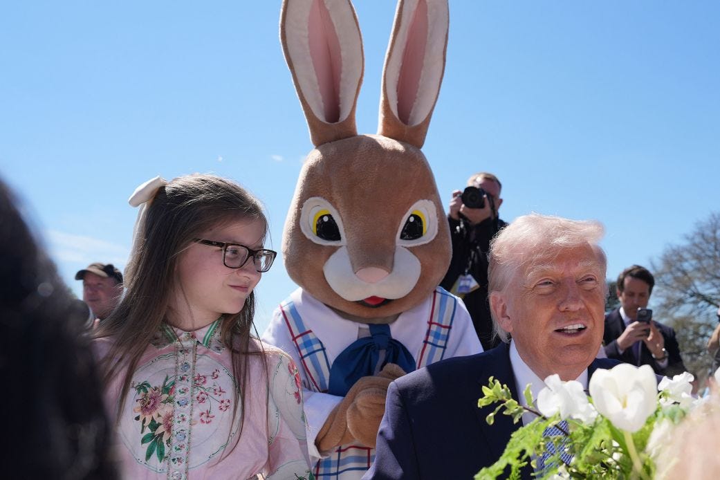 President Donald Trump sits down with children as he participates in the White House Easter Egg Roll on the South Lawn of the White House on Monday.