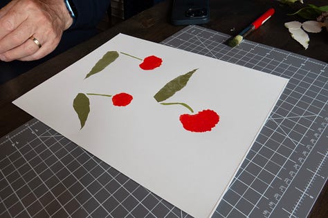 Participants working on their stencil paintings