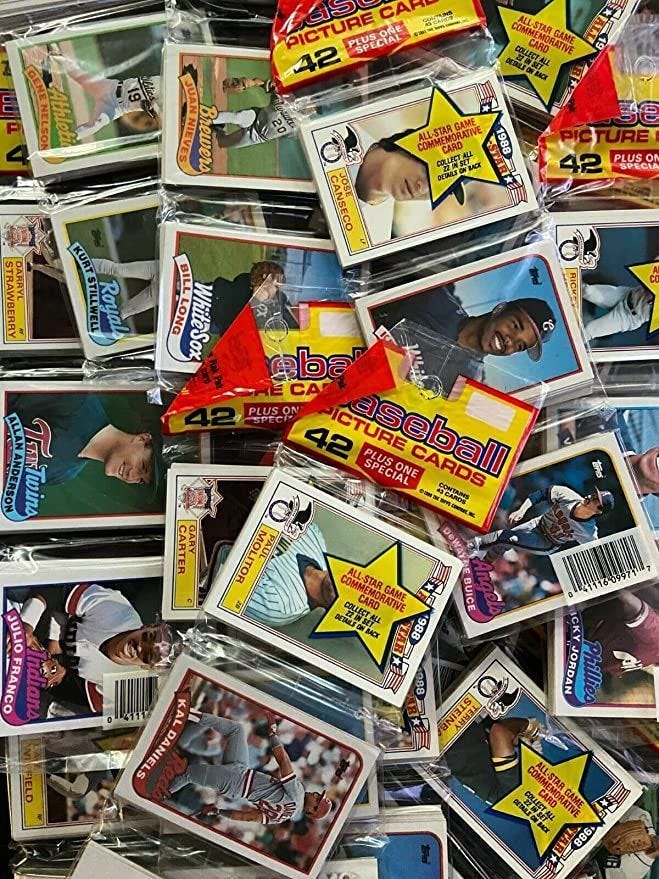 This may contain: many baseball cards are stacked on top of each other