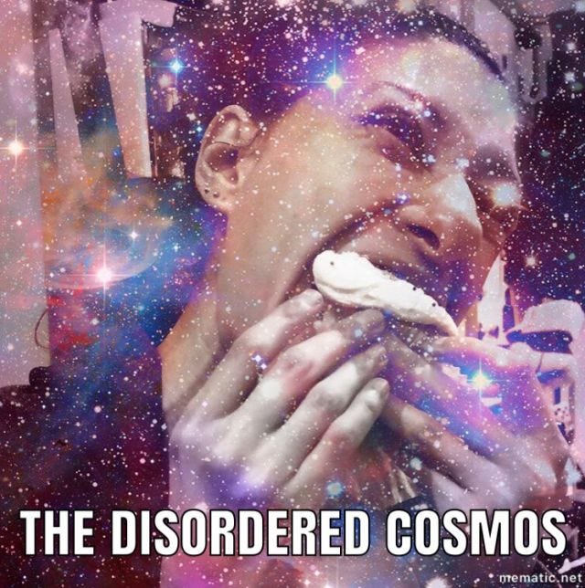 image of me eating a cupcake with the words The Disordered Cosmos image of me eating a cupcake with the words The Disordered Cosmos