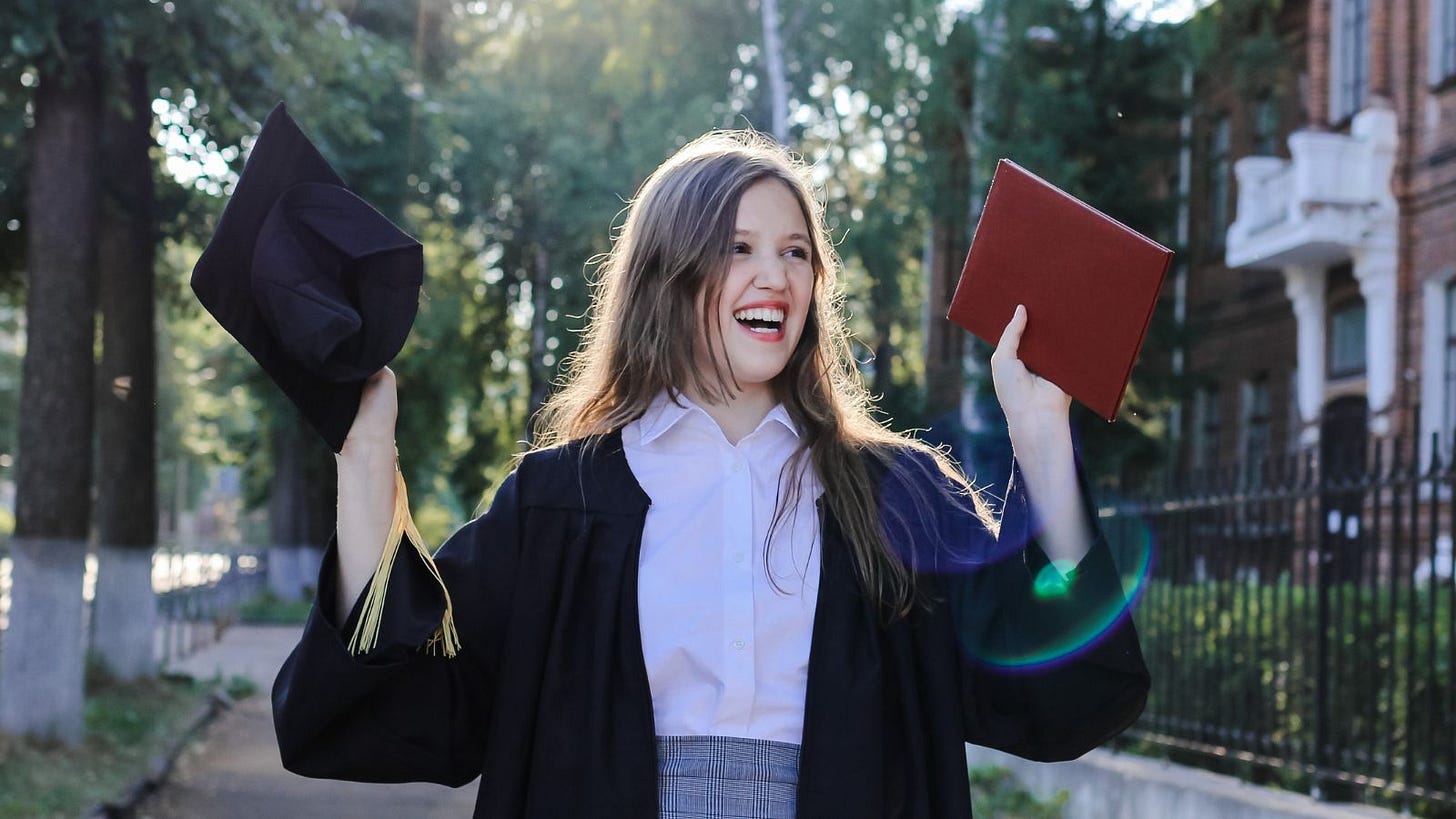 woman college degree excited school