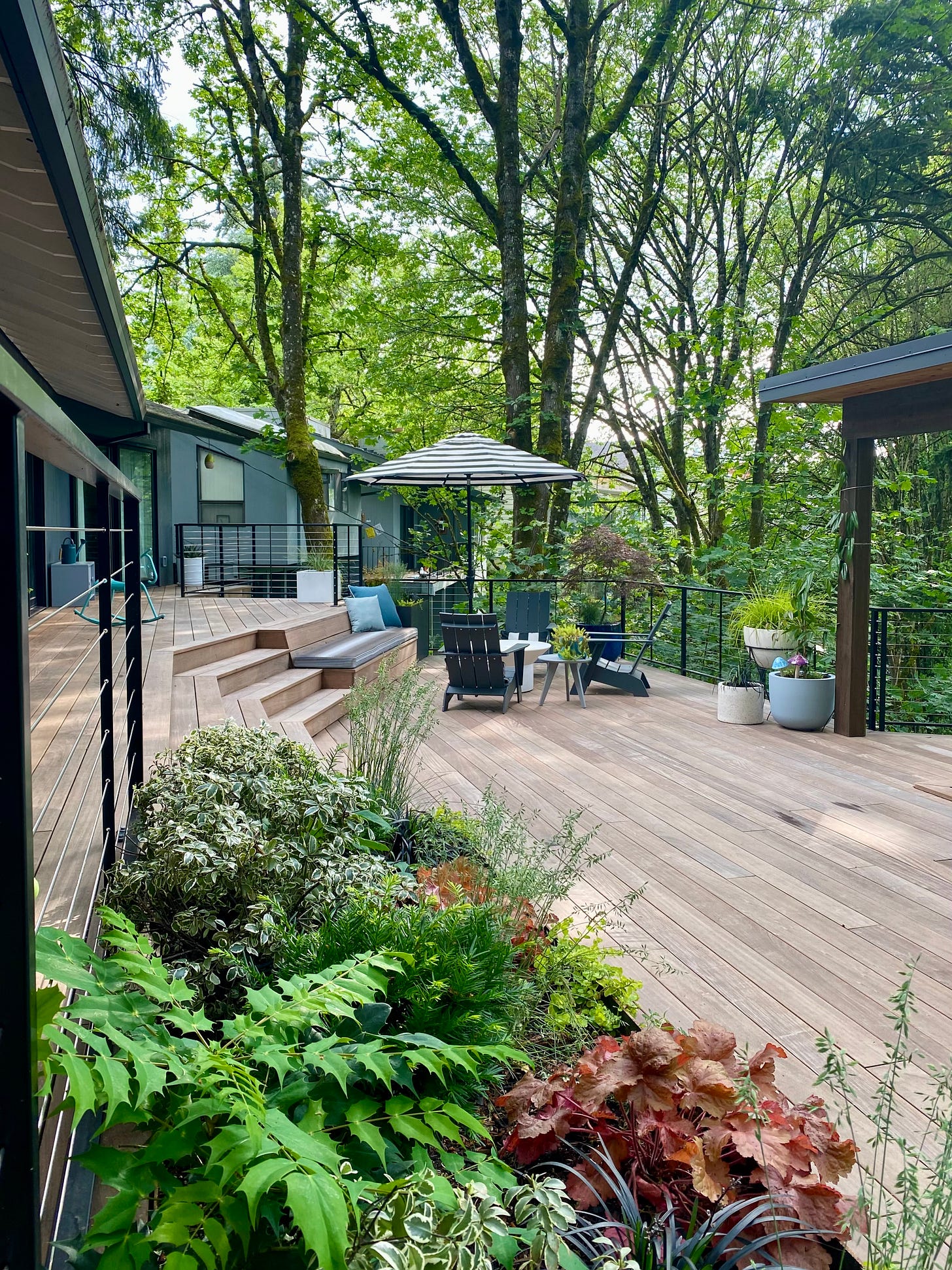 deck, summer hosting, hosting for summer, landscaping, flowers, plants, deck with plants, outdoor lounge, lounge furniture, deck furniture, plywood, dwr, loll, sunbrella