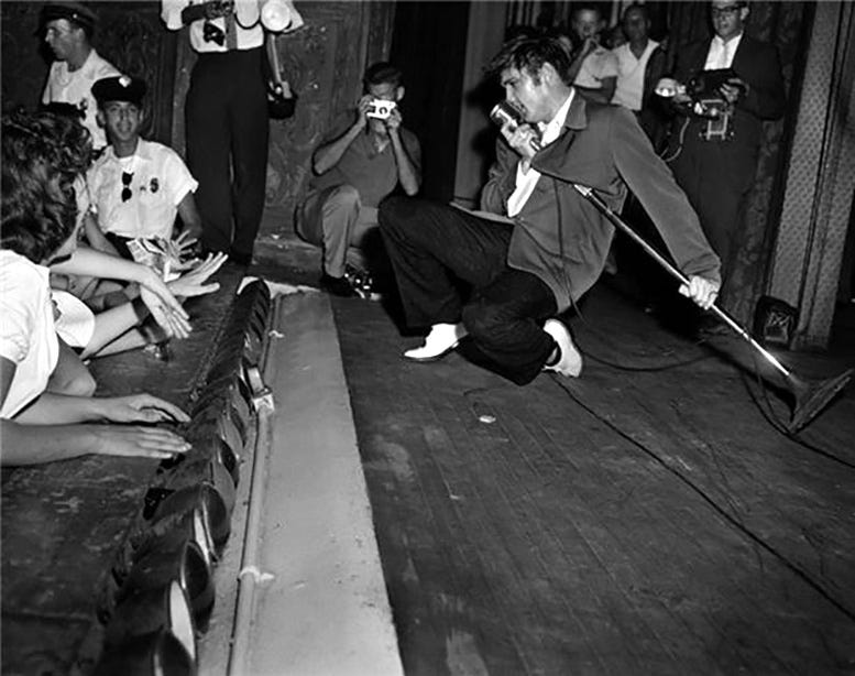 Elvis performing his signature antics at the Olympia Theater on Friday, August 3, 1956. Courtesy of Florida State Archives. Elvis performing his signature antics at the Olympia Theater on Friday, August 3, 1956. Courtesy of Florida State Archives.