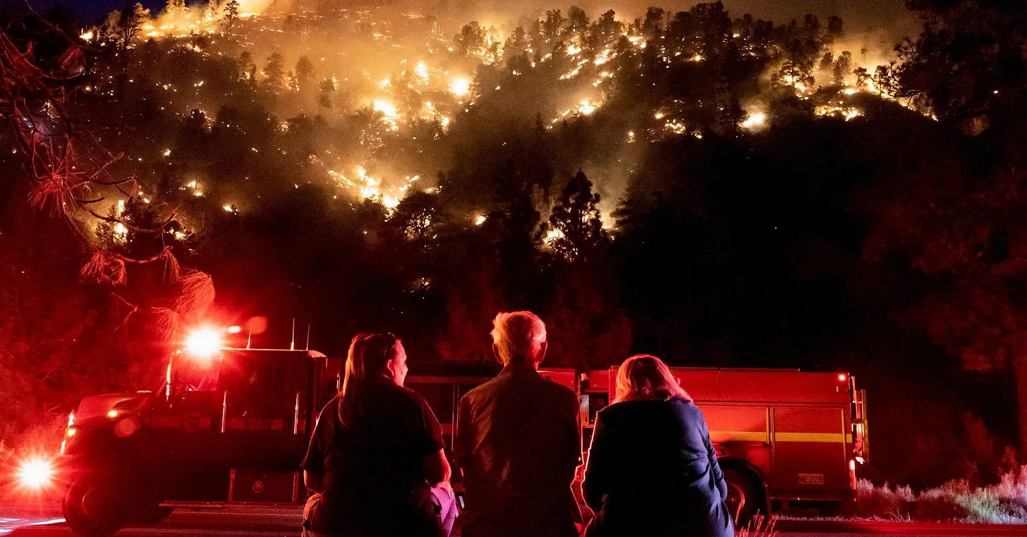 Residents watch the Sheep Fire wildfire burn near their homes in Wrightwood, California, United States; 11 June 2022. Photo by Kyle Grillot/Reuters Residents watch the Sheep Fire wildfire burn near their homes in Wrightwood, California, United States; 11 June 2022. Photo by Kyle Grillot/Reuters
