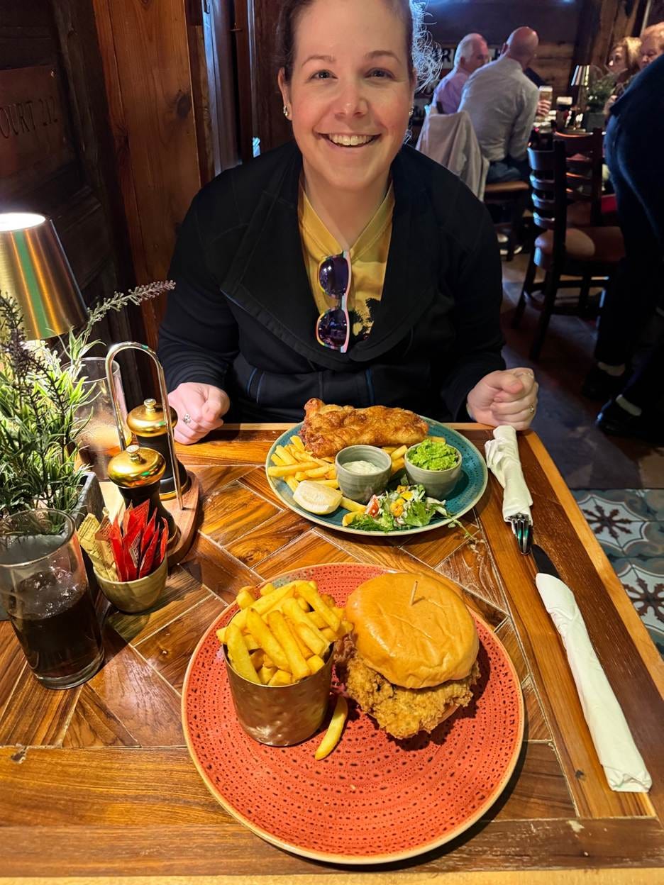 A person sitting at a table with food

AI-generated content may be incorrect.