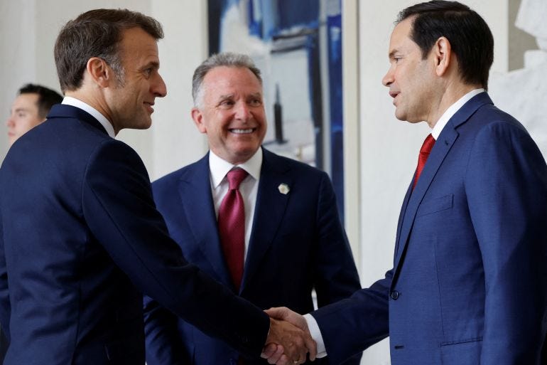 Emmanuel Macron shakes hands with US Secretary of State Marco Rubio as US envoy Steve Witkoff looks on Emmanuel Macron shakes hands with US Secretary of State Marco Rubio as US envoy Steve Witkoff looks on