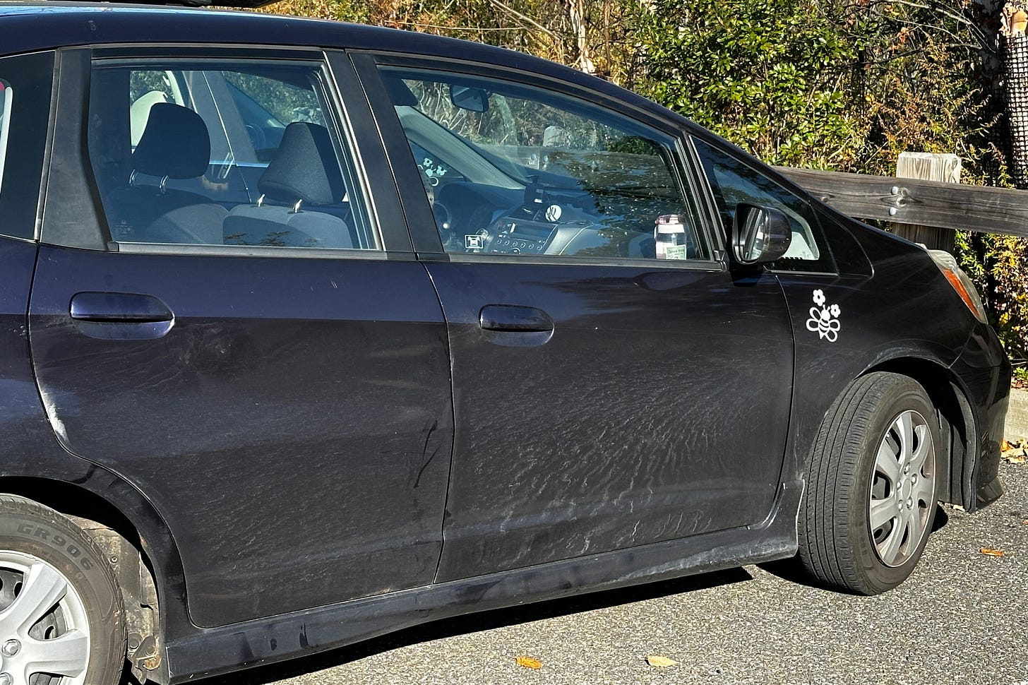 my purple 2010 honda fit with a bee sticker on the front passenger side panel my purple 2010 honda fit with a bee sticker on the front passenger side panel