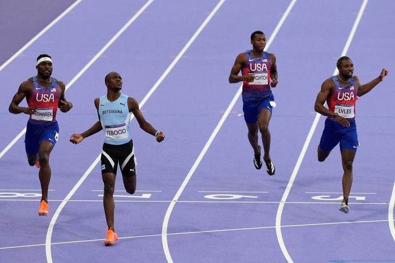 Letsile Tebogo, of Botswana, second left, wins the men’s 200-meters final at the 2024 Summer Olympics, Thursday, Aug. 8, 2024, in Saint-Denis, France. (AP Photo/Martin Meissner)