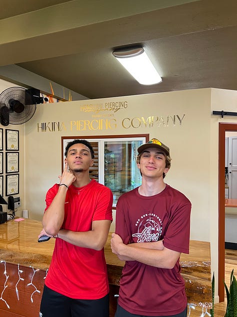 Three photos showing the growth of two best friends over the years — as young boys holding Pomeranian puppies, as teenagers sitting in a car, and as young men posing together at a piercing company. From little kids with fluffy dogs to full-on grown humans.