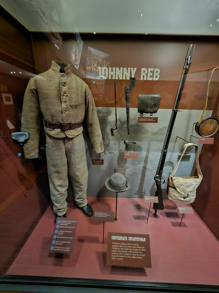 A flag and a confederate soldier at the gettysburg visitor center.