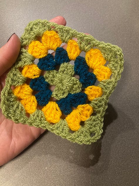 Messy heap of yarns and crochet hooks, a crochet Christmas bauble in Wicked colours (pink and green), my first crochet granny square