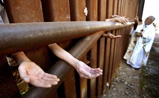 Cardinal, bishops say Mass at Nogales border fence, urge changes in immigration law Cardinal, bishops say Mass at Nogales border fence, urge changes in immigration law