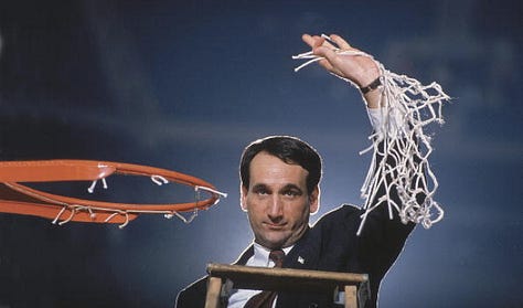 Coach K cutting the nets