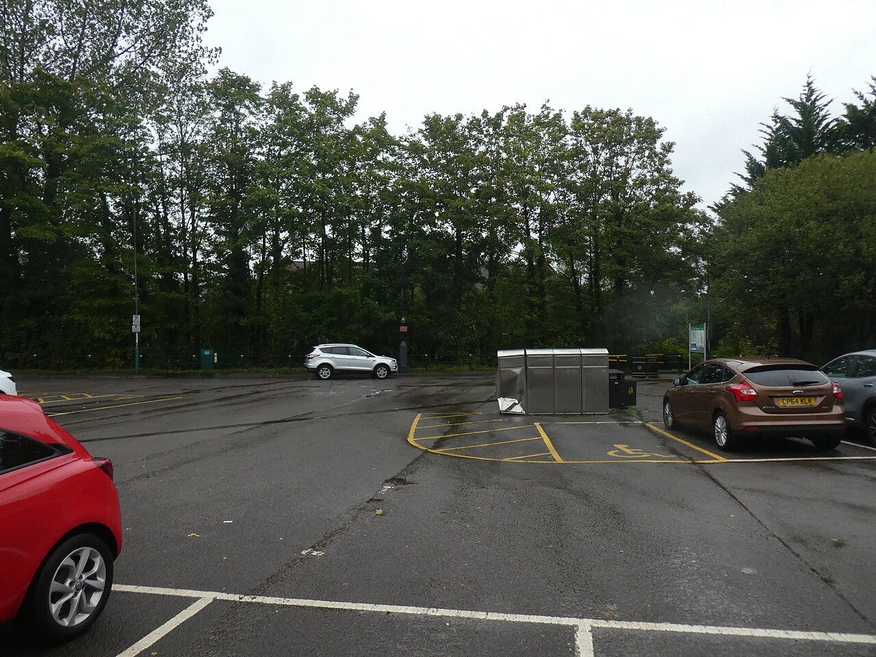 Photo: David Smith / Wikimedia Commons (CC BY-SA 2.0) Car park off Crescent Road, Caerphilly with damaged bin