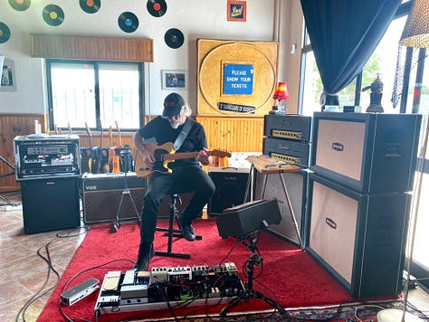 Musical equipment and people inside a recording studio