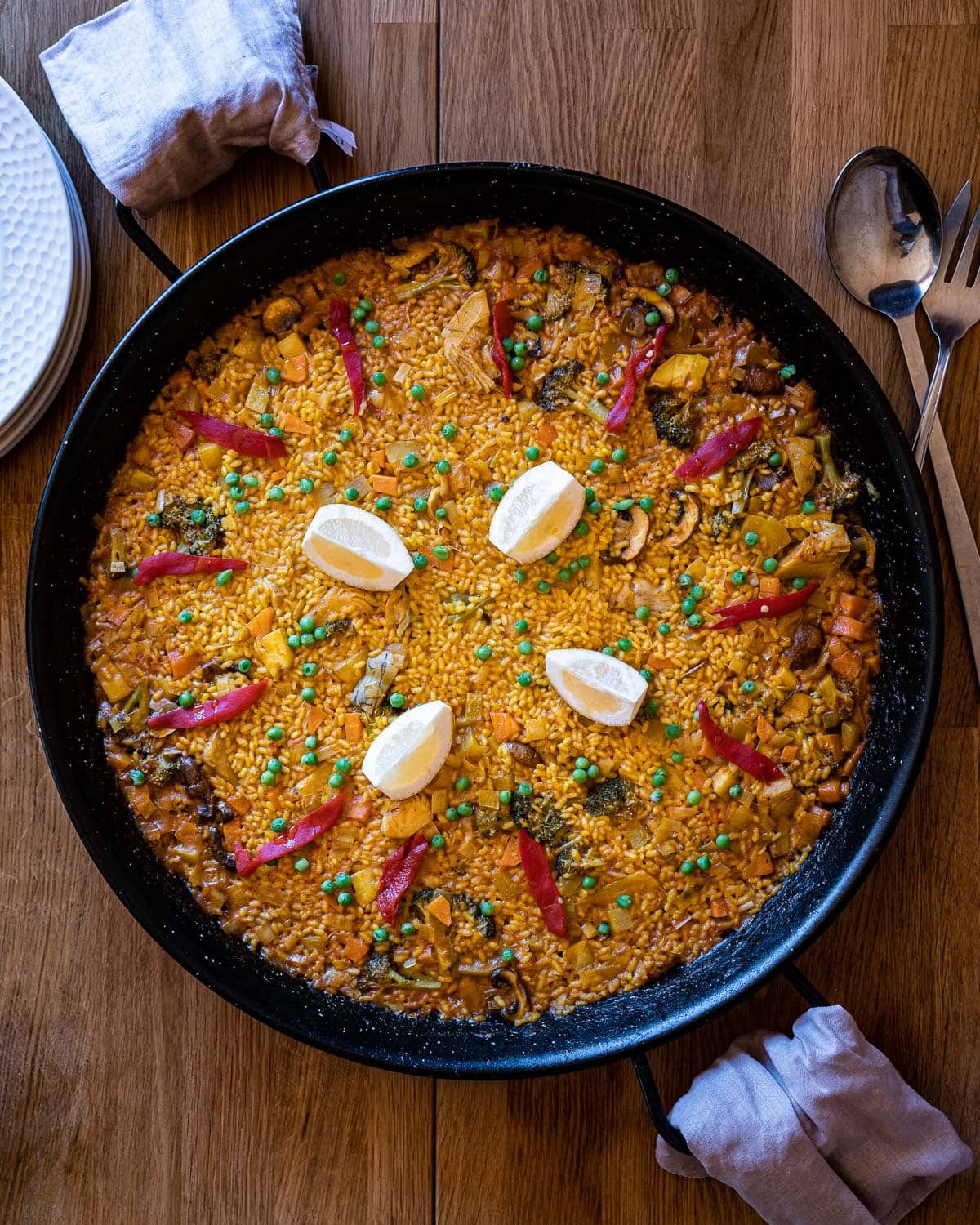 Paella pan with vegetarian paella beautifully plated.