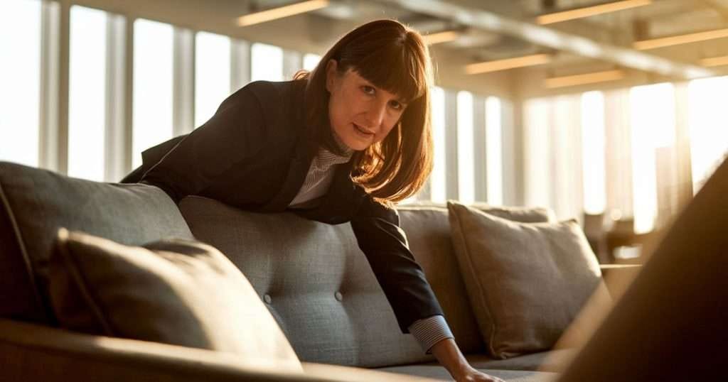 Rachel Reeves looking down back of sofa