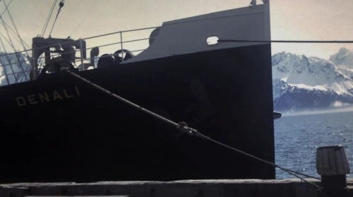 An image of an old ship, the Denali, at a dockside in Alaska.