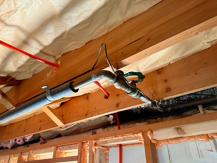 Photos of plumbing rough-in work.
