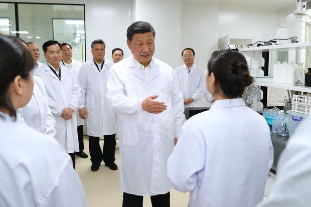 Chinese President Xi Jinping visiting the Traditional Chinese Medicine Science and Technology Industrial Park of...