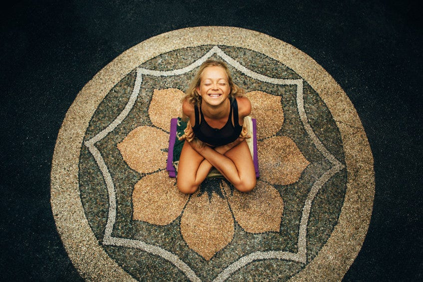 ecstatic women's face doing Yoga