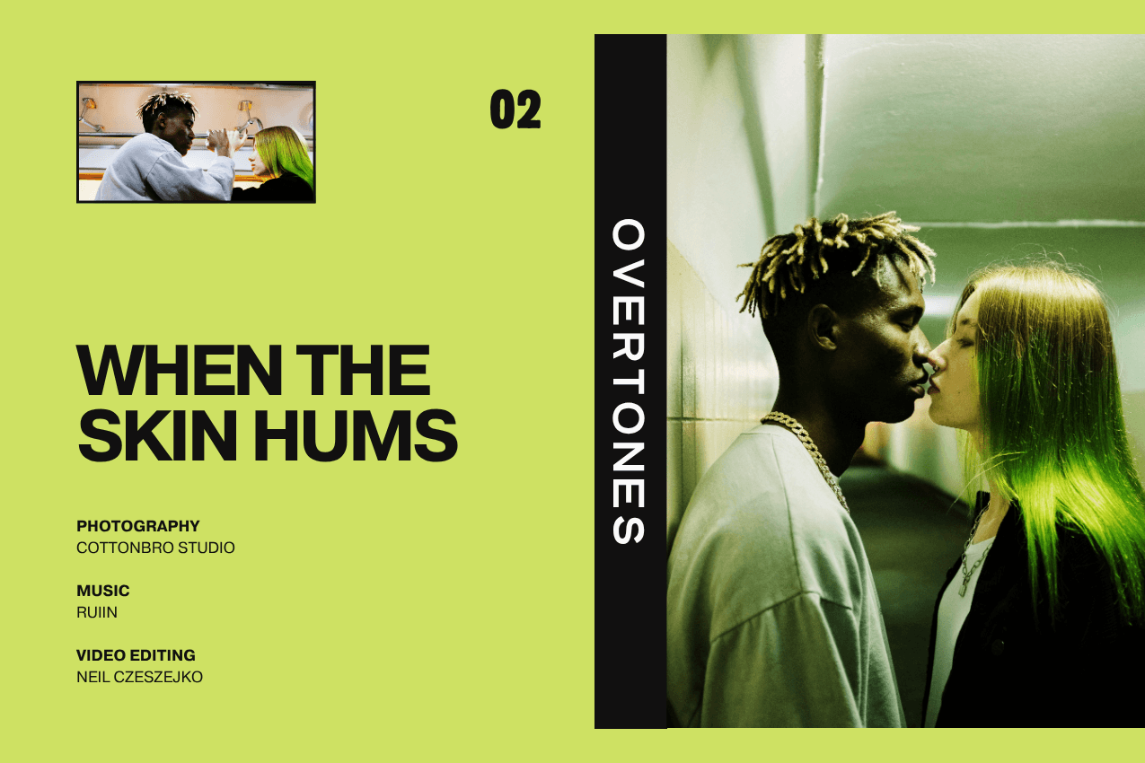 Cover for the short film "When the Skin Hums": A young man and woman stand in close proximity within a green-tiled corridor, as though about to kiss. The layout features an acidic lime-green field with a secondary inset image in the top-left and minimalist production credits in the bottom-left. Part of the Overtones series at The Subtext Review.
