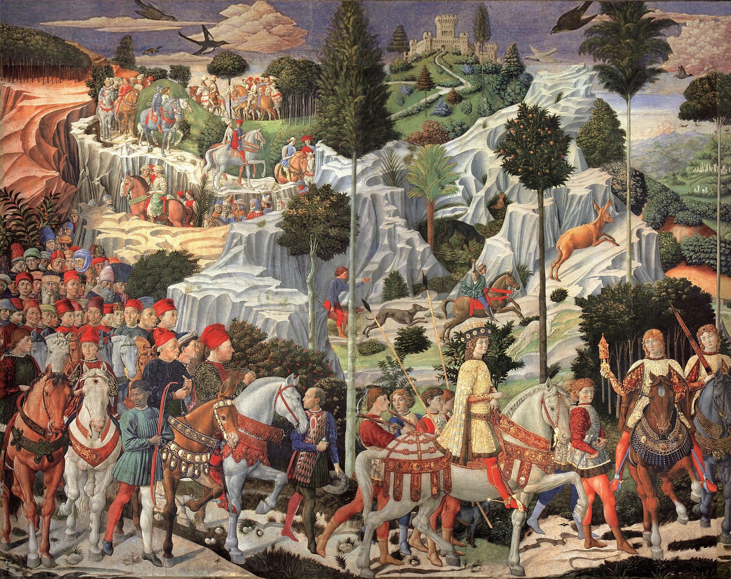 Procession of the Magi by Benozzo Gozzoli: Medici riders and a crowd in red caps cross a rocky Tuscan landscape