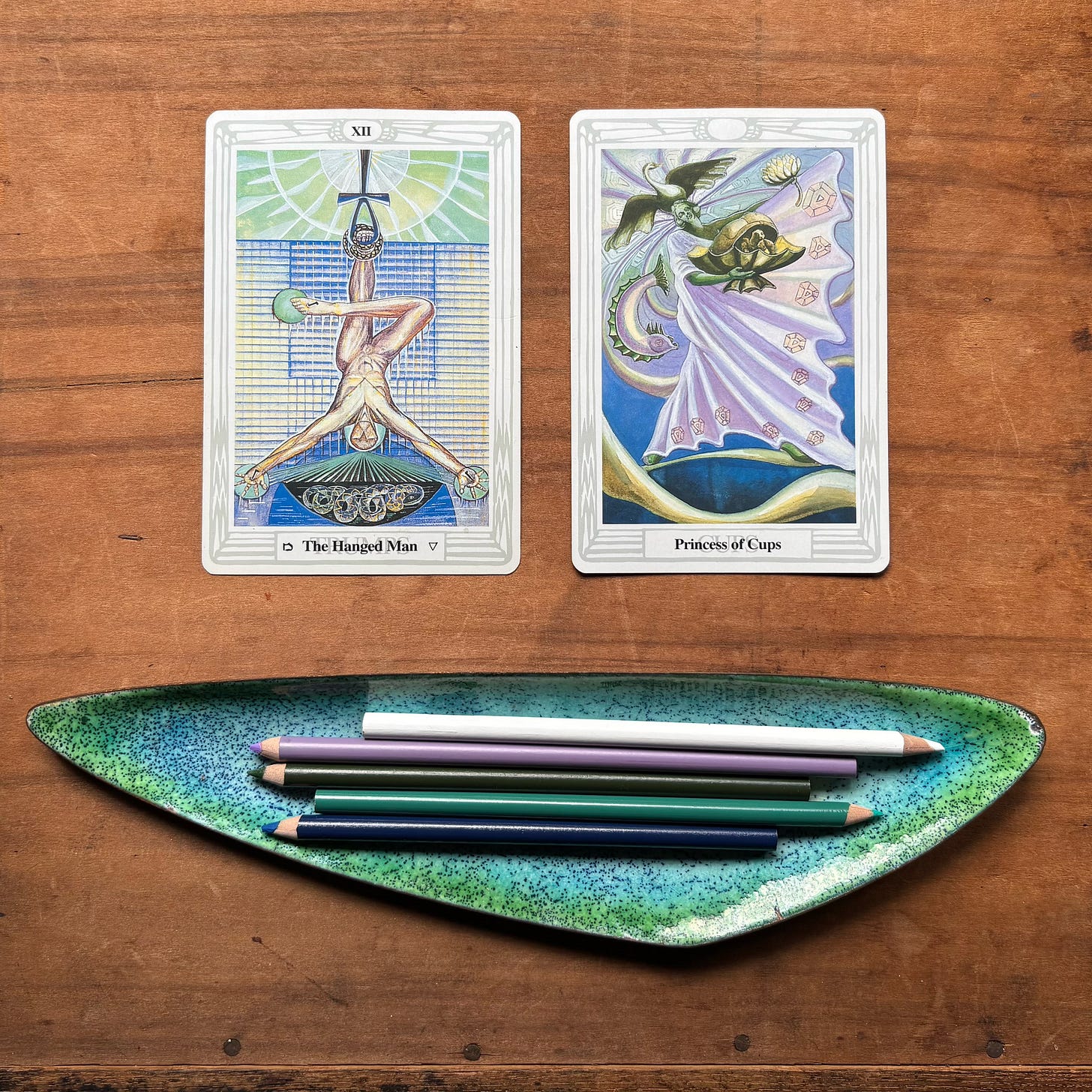 The Hanged Man and the Princess of Cups, side by side, to illustrate the color relationship.