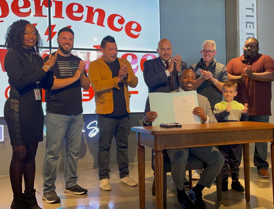 Milwaukee Mayor Cavalier Johnson signing the resolution for the Walker's Point Innovation District. Milwaukee Mayor Cavalier Johnson signing the resolution for the Walker's Point Innovation District.