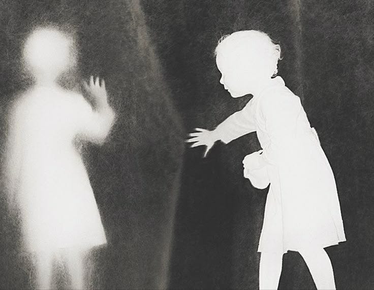 This may contain: a black and white photo of a child standing in front of a shadow