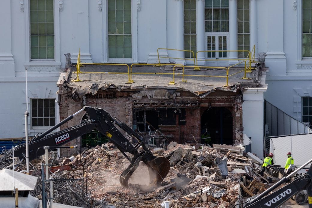 An excavator works to clear rubble after the East Wing of the White House was demolished, on Thursday.