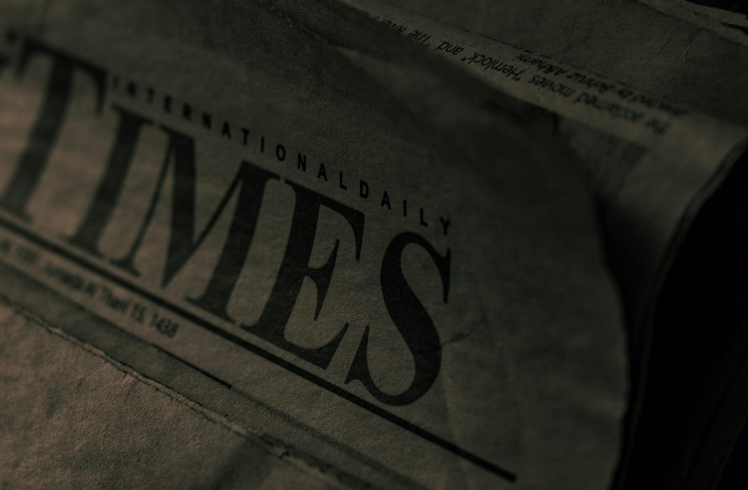 newspapers stacked on top of each other on a table