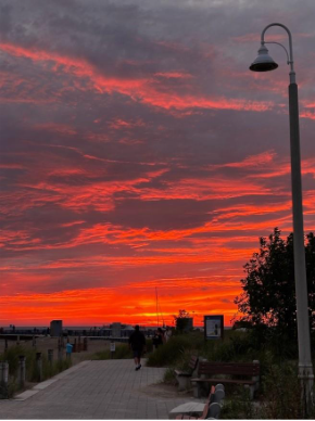 A sunset over a beach AI-generated content may be incorrect. A sunset over a beach AI-generated content may be incorrect.