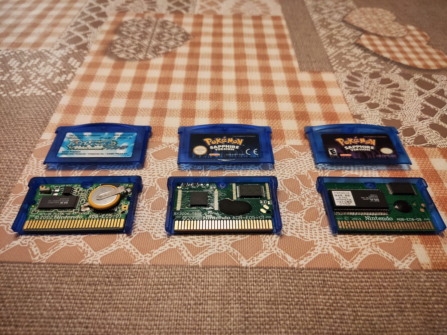 Copies of Pokémon Sapphire. Left side is a genuine Japanese copy, centre is a reproduction, right side is also a reproduction (Photo credit: Lucent) Copies of Pokémon Sapphire. Left side is a genuine Japanese copy, centre is a reproduction, right side is also a reproduction (Photo credit: Lucent)