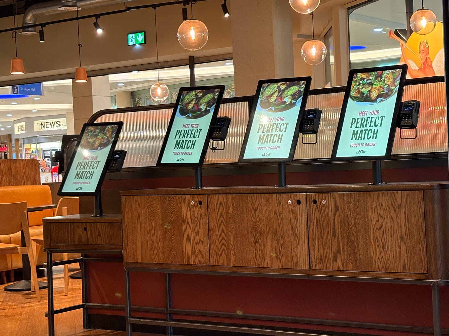 4 screens with the text "The perfect match", one is lowered and has room beneath