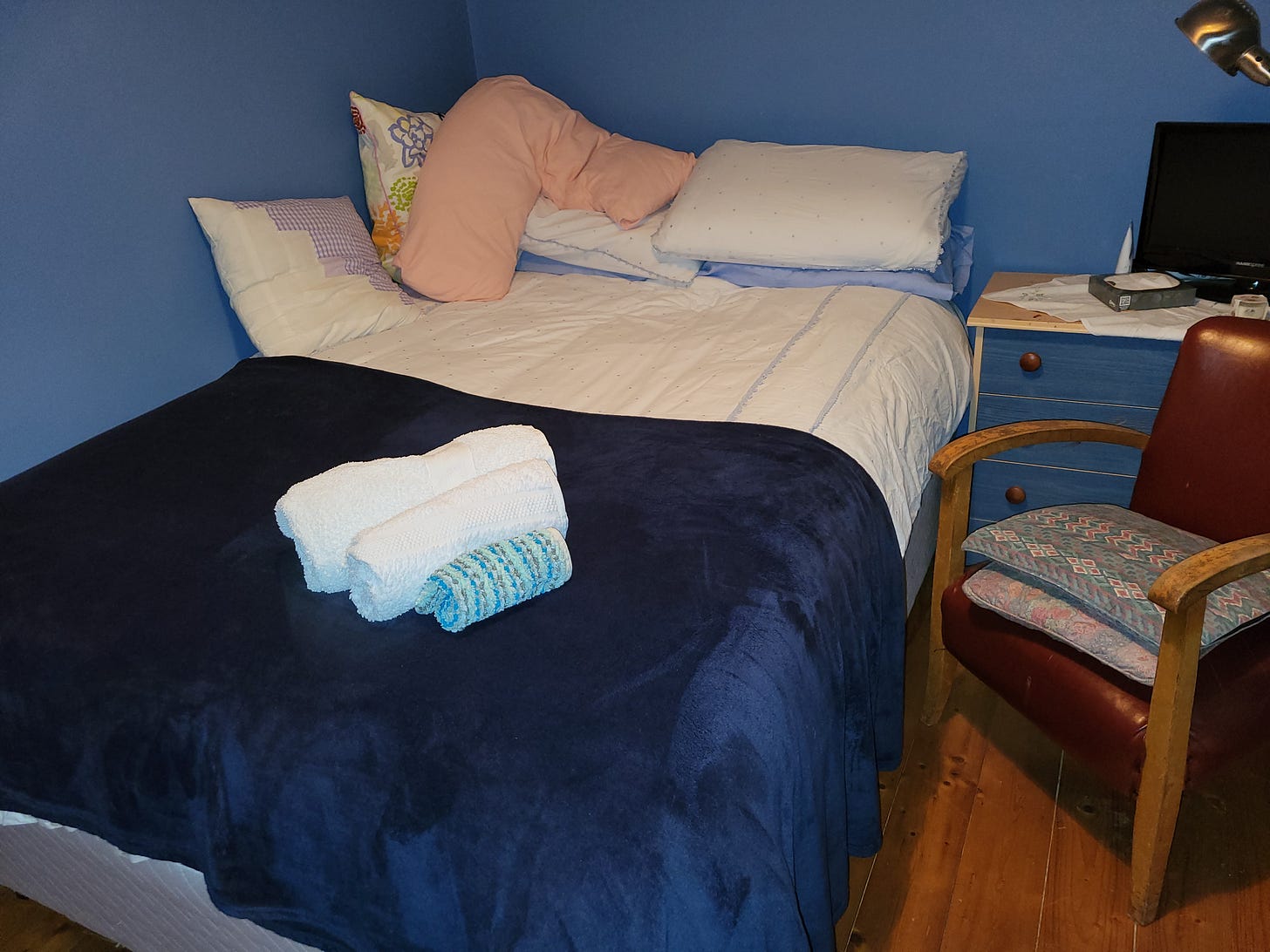 Bed made up for a guest.